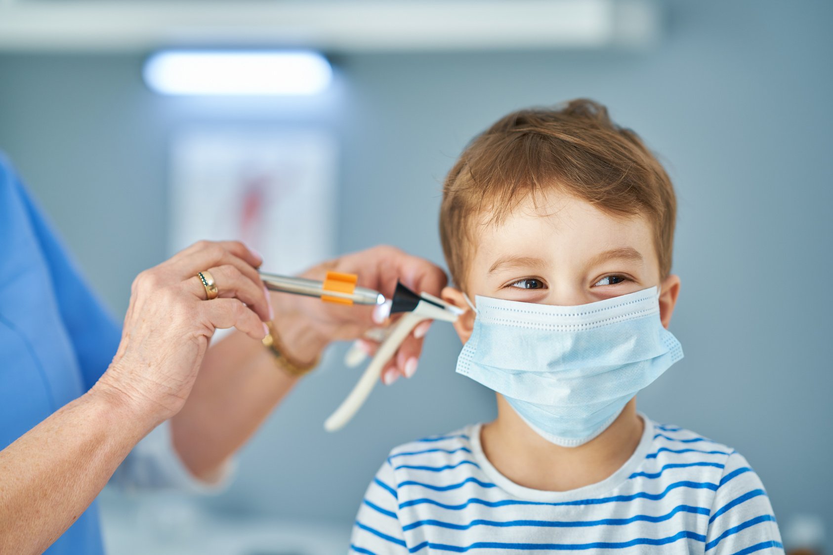 Pediatrician Doctor Examining Little Kids in Clinic Ears Check